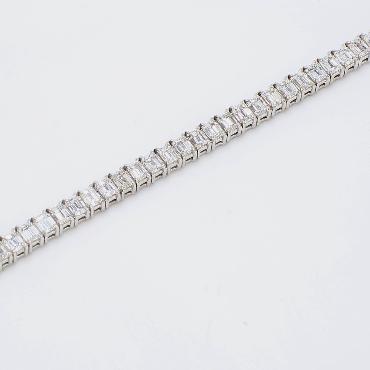 7' Tennis bracelet in platinum with F/VS prong set emerald cut diamonds.  D11.03ct.t.w.