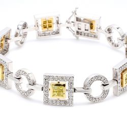 7' Link bracelet in 2-tone with round & alternating 2x2 princess cut diamonds.  D3.10ct.t.w.