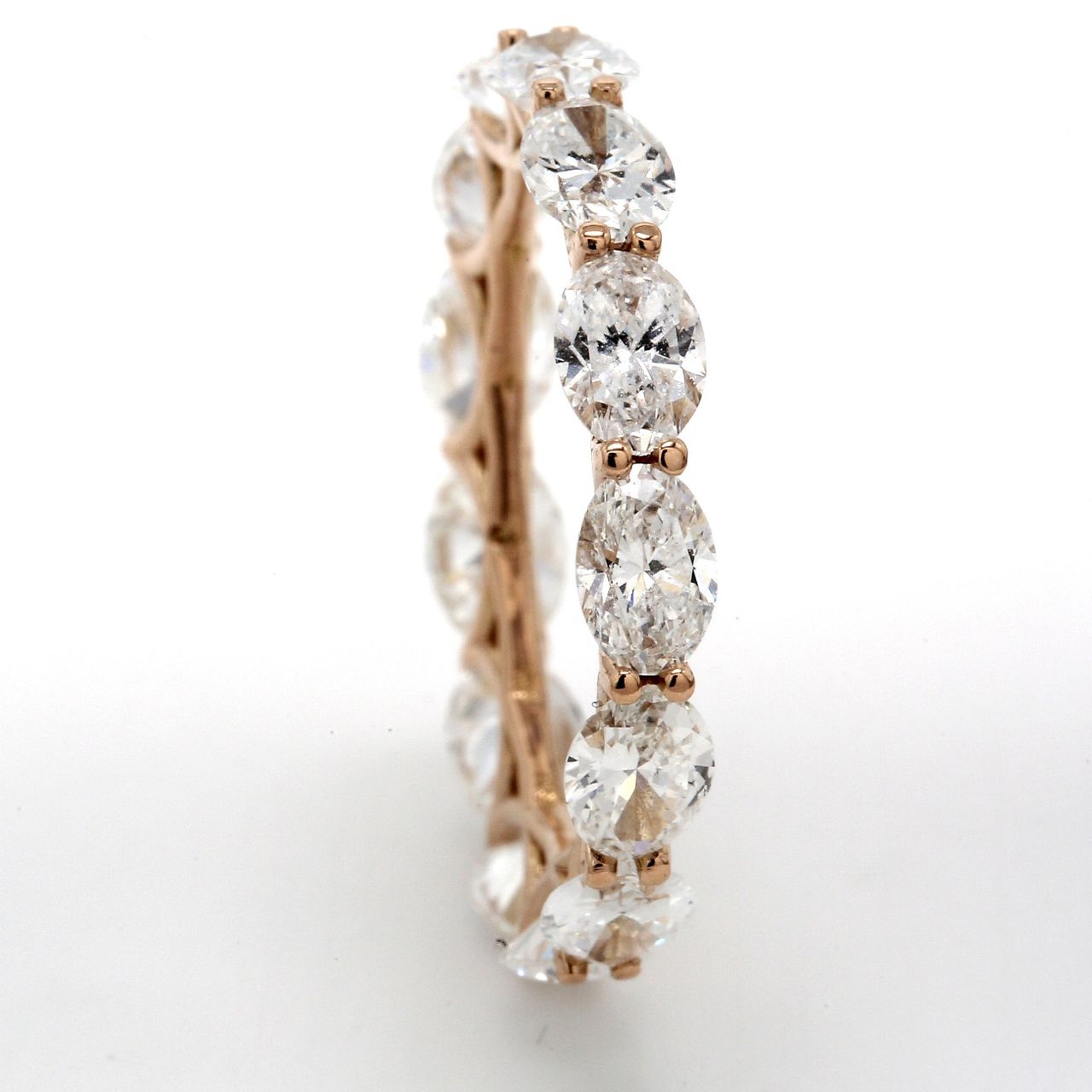 Eternity band in 18K RG with prong set sideway (13) oval cut diamonds.  D3.78ct.t.w.  Size 6.75