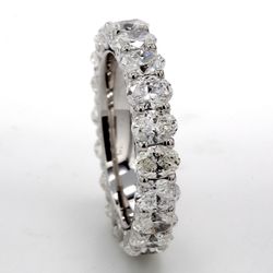Eternity band in 18K WG with shared U-prong set (20) oval diamonds.  D3.72ct.t.w.  Size 5.5