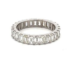 Eternity band in platinum with prong set (28) emerald cut diamonds.  D2.83ct.t.w.  Size 6