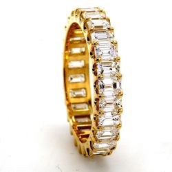 Eternity band in 18K YG with U-prong set (26) emerald cut diamonds.  D2.82ct.t.w.  Size 6.25