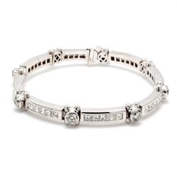 8' Link bracelet with alternating bezel set rounds & channel set princess cut diamonds.  D12.11ct.t.w.