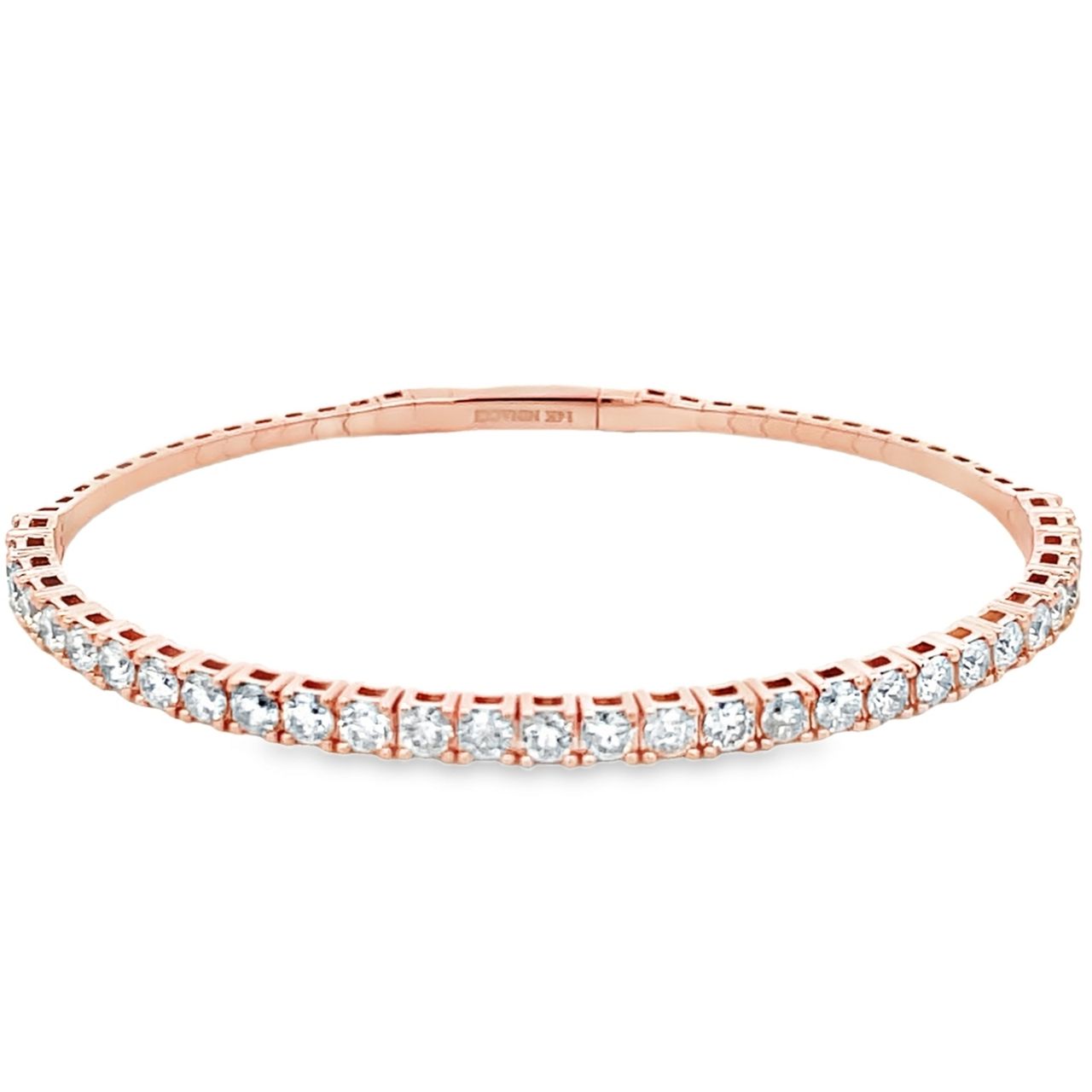 6.5' Light weight flexible oval shaped bangle in rose gold with prong set round diamonds.  D2.50ct.t.w.