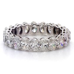 Eternity band in white gold with basket prong set (21) oval cut diamonds.  D2.89ct.t.w.  Size 4.75