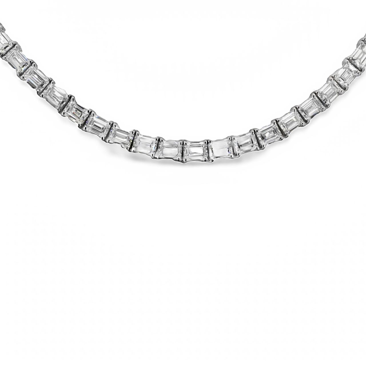 18' Tennis necklace east to west style in 18K WG with 4-prong set (92) emerald cut diamonds.  D29.90ct.t.w.
