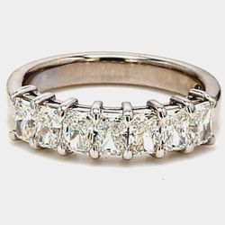 7-stone band in platinum with basket prong set radiant cut diamonds.  D1.42ct.t.w.  Size 6
