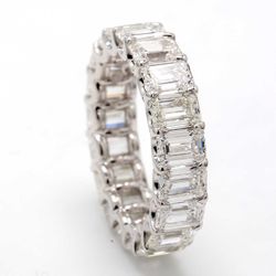 Eternity band with shared U-prong set (19) emerald cut diamonds.  D5.79ct.t.w.  Size 4.5