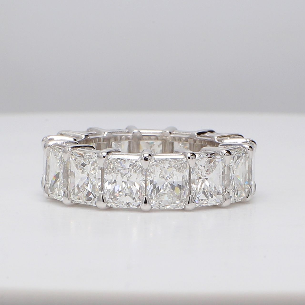 Eternity band in platinum with basket set G/VS1 (15) radiant cut diamonds.  D11.09ct.t.w.  Size 5.5