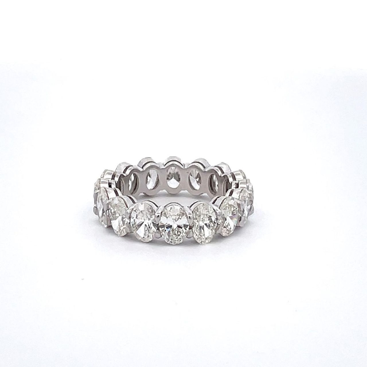 Eternity band in platinum with shared basket prong set GIA certified G-I/VS1-SI1 (16) oval cut diamonds.  D6.52ct.t.w.  Size 6.75