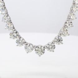 17' Graduated tennis necklace in 18K WG with 3-prong set round diamonds.  D18.63ct.t.w.