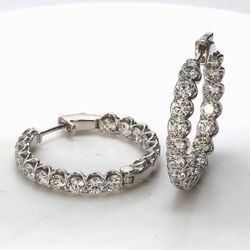 1' Inside out hoop earrings w/ shared prong set round diamonds.  D6.26ct.t.w.