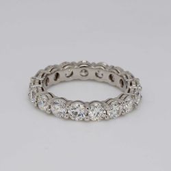 Eternity band in platinum with shared prong set round diamonds.  D3.24ct.t.w.  Size 5.75