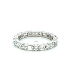 Eternity band east west style in platinum with prong set alternating (11) emerald cuts and (11) round diamonds.  D1.42ct.t.w.  Size 5