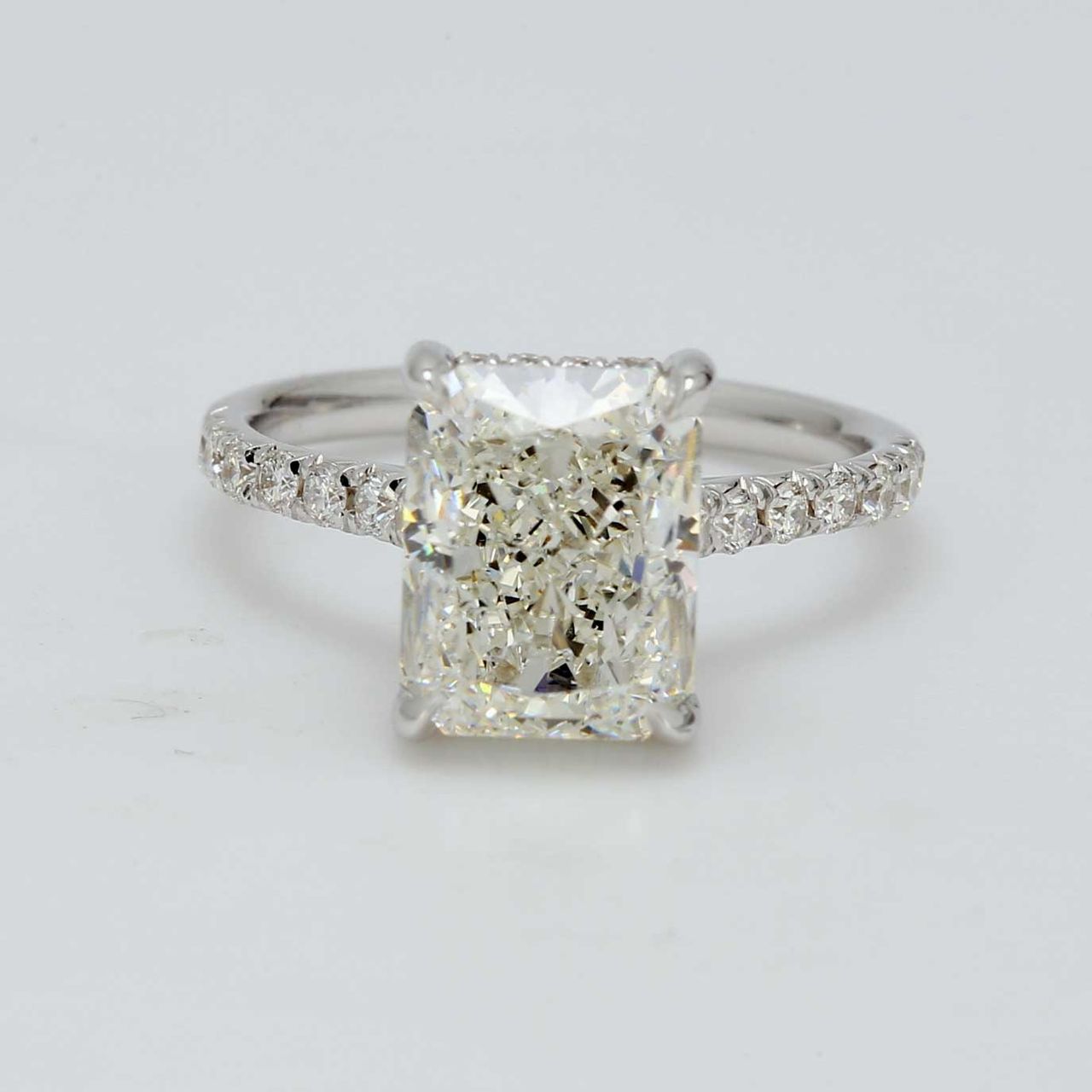 Halo semi-mount in 18K WG with french pave set round diamonds.  D0.32ct.t.w.  Size 5