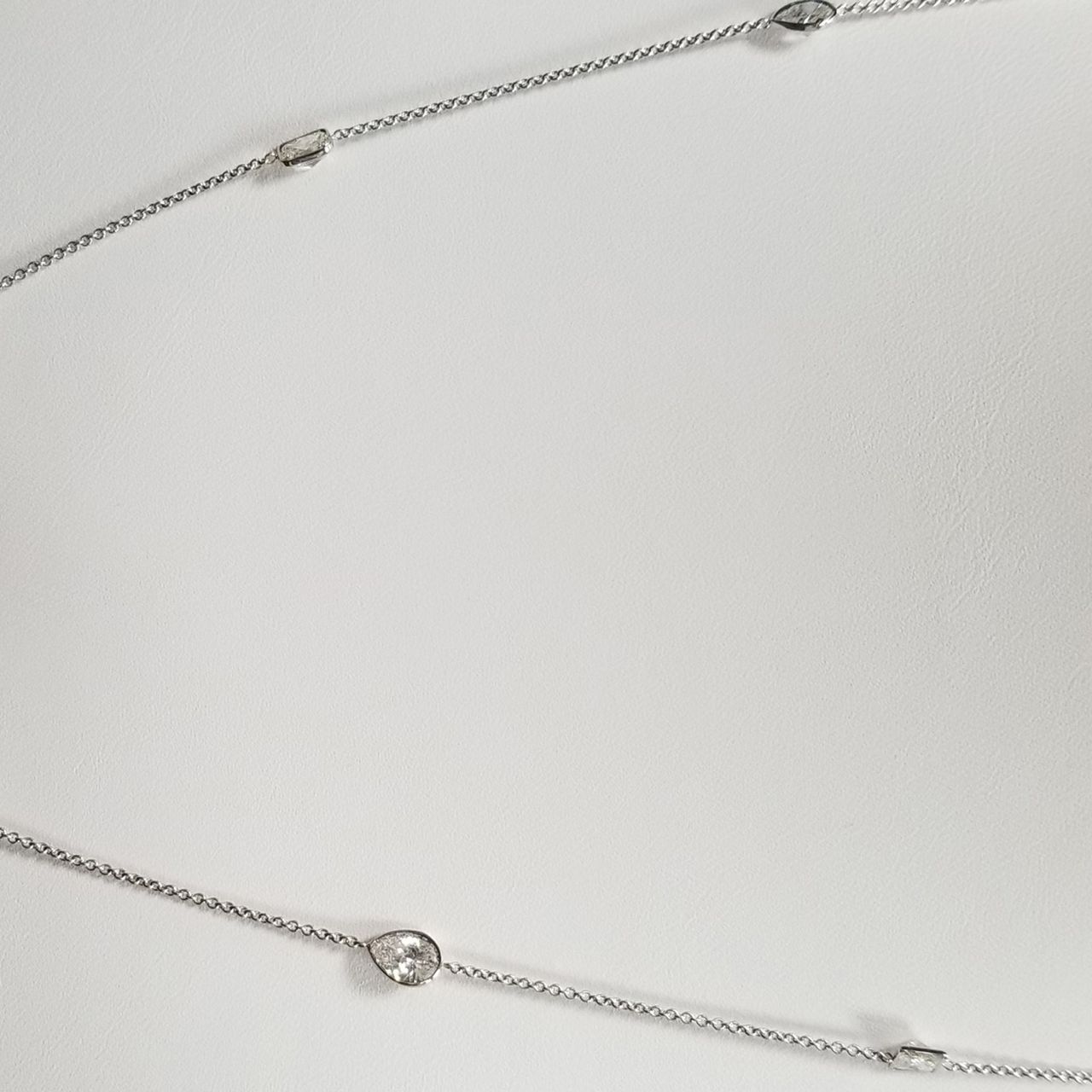 19' Diamonds by the yard necklace in 18K WG with bezel set princess, pear, & radiant diamonds.  D3.56ct.t.w.