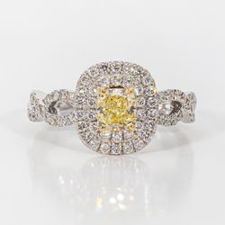 Double halo criss cross shank ring in 18K WG with rounds around a FY cushion cut diamond center stone.  D1.15ct.t.w.  (Center 0.57ct.)  Size 6.75