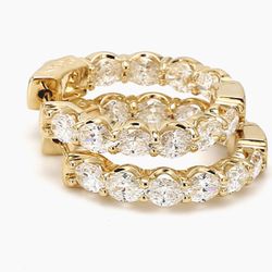 0.75'  Inside out hoop earrings east west style in 14K YG with prong set (20) oval cut diamonds.  D4.83ct.t.w.