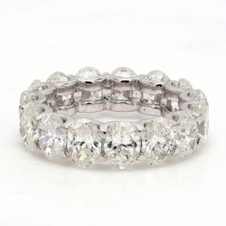Eternity band in platinum with U-prong set G/VS (15) oval diamonds.  D7.67ct.t.w.  Size 6