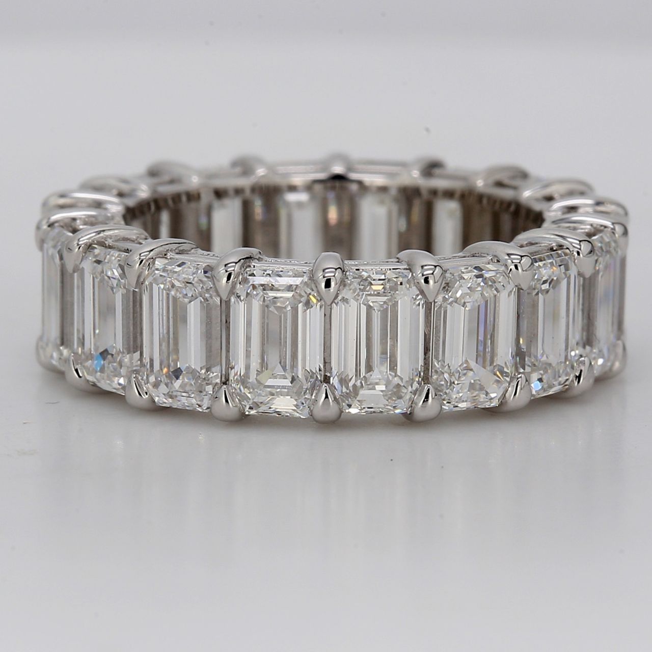 Eternity band in platinum with basket claw set GIA certified D-E/IF-VS (18) emerald cut diamonds.  D9.02ct.t.w.  Size 6