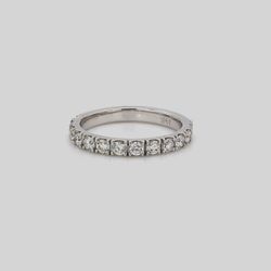 Band with u-prong set round diamonds.  D0.57ct.t.w.  Size 5