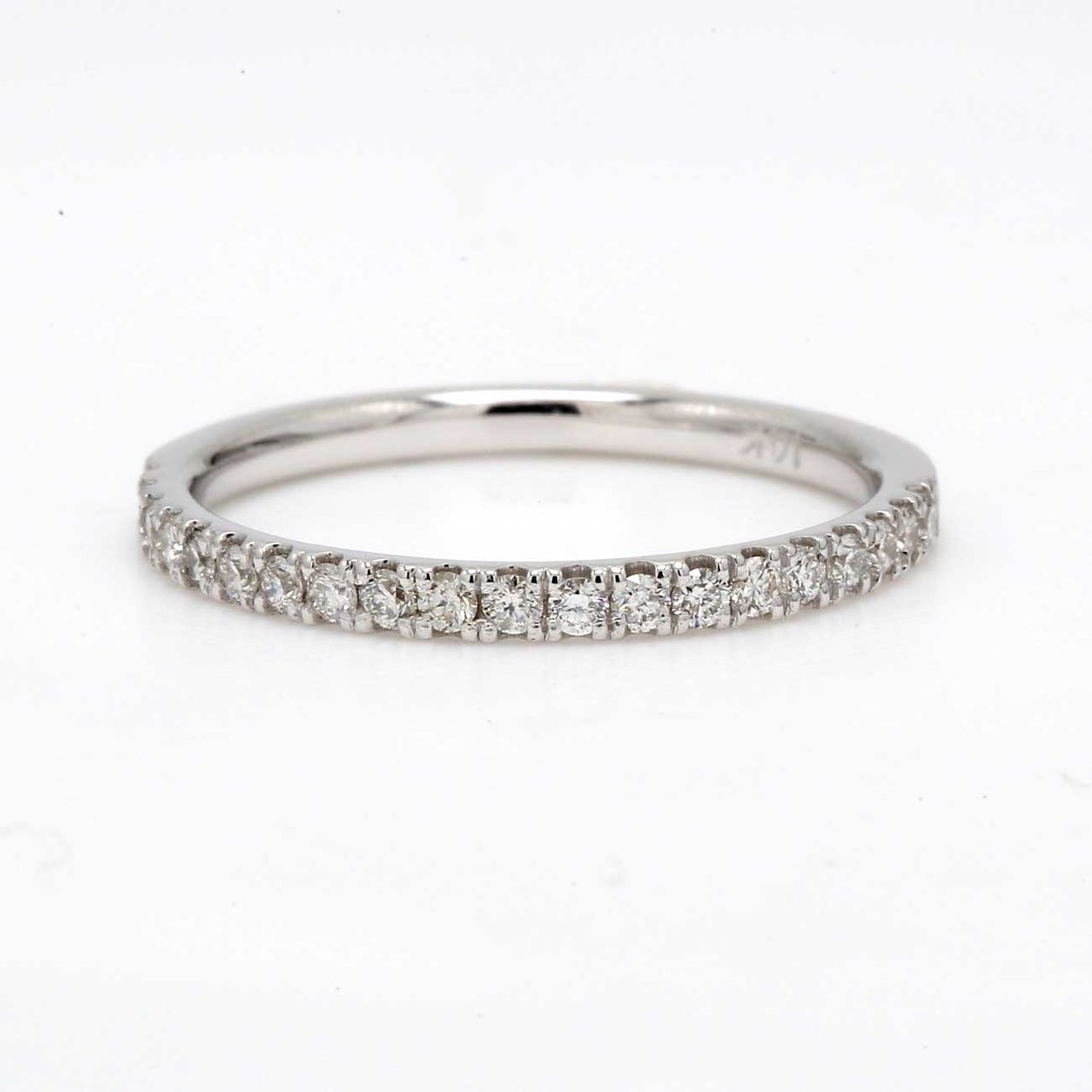 Band with 4-prong set (20) round diamonds.  D0.29ct.t.w.  Size 7.25