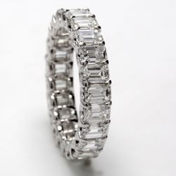 Eternity band in platinum with U-prong set (23) emerald cut diamonds.  D4.41ct.t.w.  Size 6