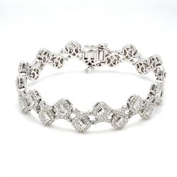 7' Designer bracelet in 18K WG with halo and pave set rounds around bezel set radiant cut diamonds.  D5.81ct.t.w.