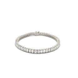 7' Tennis bracelet in platinum with basket prong set (60) emerald cut diamonds.  D11.05ct.t.w.