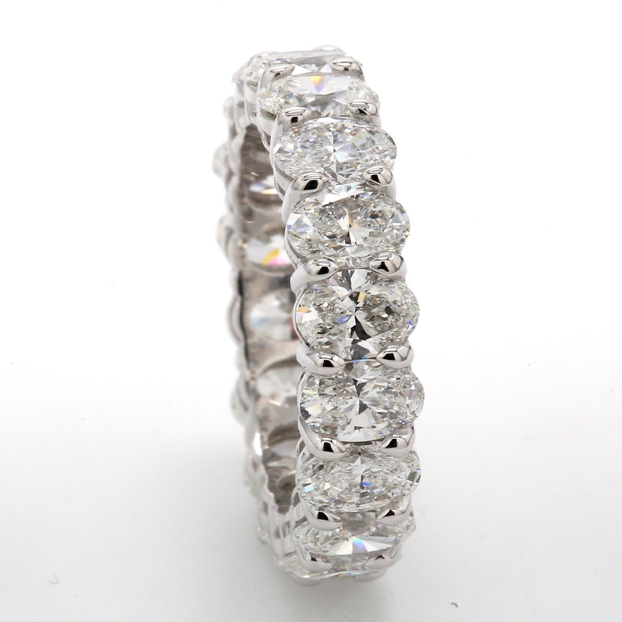 Eternity band in platinum with basket prong set (18) oval diamonds.  D4.32ct.t.w.  Size 5