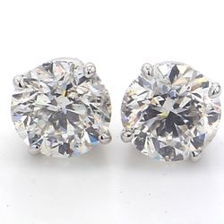 Pushback stud earrings with 4-prong basket set round diamonds.  D3.02ct.t.w.
