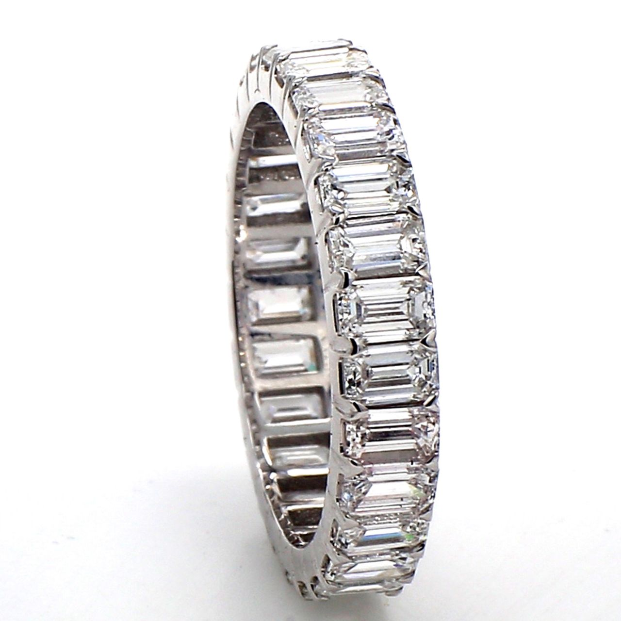 Eternity band with prong set (27) emerald cut diamonds.  D2.45ct.t.w.  Size 4.75