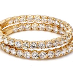 1.5' Inside out hoop earrings in yellow gold with prong set (52) round diamonds.  D8.72ct.t.w.
