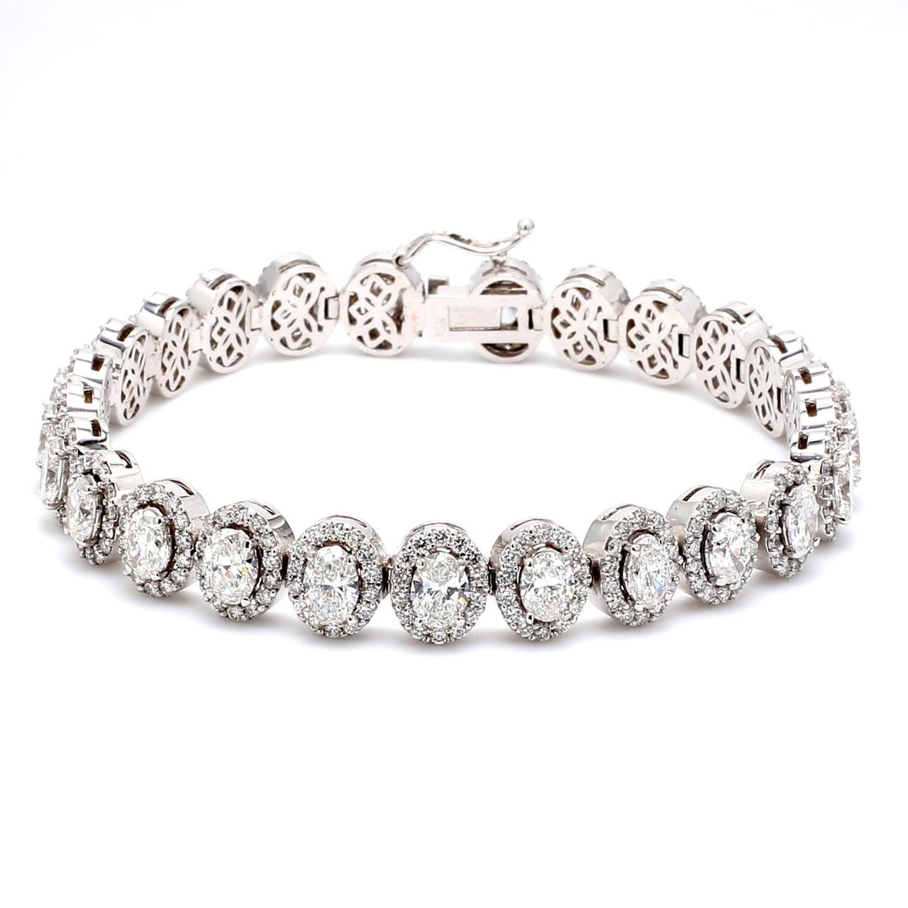 7' Designer halo bracelet in 18K WG with prong set rounds & 4-prong set oval diamonds.  D11.60ct.t.w.