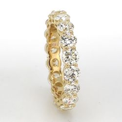 Eternity band in 18K YG with basket prong set (18) round diamonds.  D3.75ct.t.w.  Size 6.75