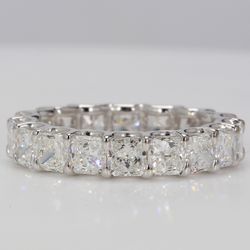Eternity band in Platinum with U-prong set F+/VS+ (18) square radiant diamonds.  D4.46ct.t.w.  Size 6.75