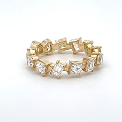 Eternity band in 18K YG with 4-prong set multi shape diamonds.  D2.48ct.t.w.  Size 5.75