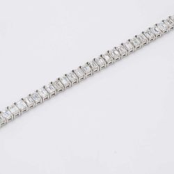 7' Tennis bracelet with 4-prong set (57) emerald cut diamonds.  D8.88ct.t.w.