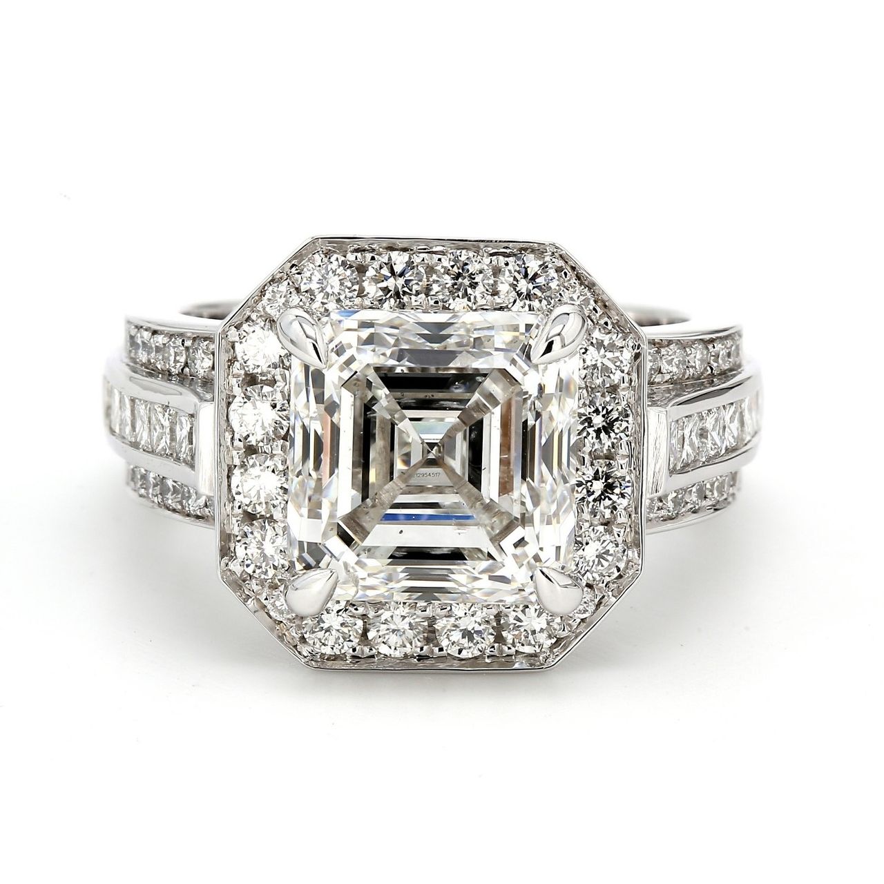 Halo semi-mount with channel set princess cuts and pave set round diamonds.  D1.50ct.t.w.