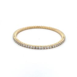 Flex bracelet in 18K YG with prong set round diamonds.  D5.74ct.t.w.