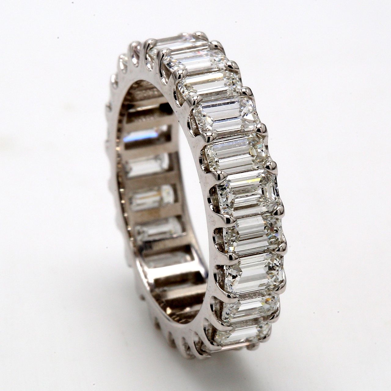 Eternity band in platinum with U-prong set (24) emerald cut diamonds.  D3.74ct.t.w.  Size 5