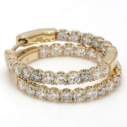 1' Inside out hoop earrings in yellow gold with prong set (34) round diamonds.  D2.22ct.t.w.