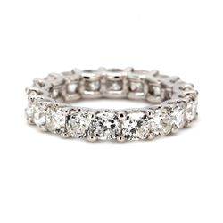 Eternity band in platinum with U-prong set (18) cushion cut diamonds.  D5.54ct.t.w.  Size 6