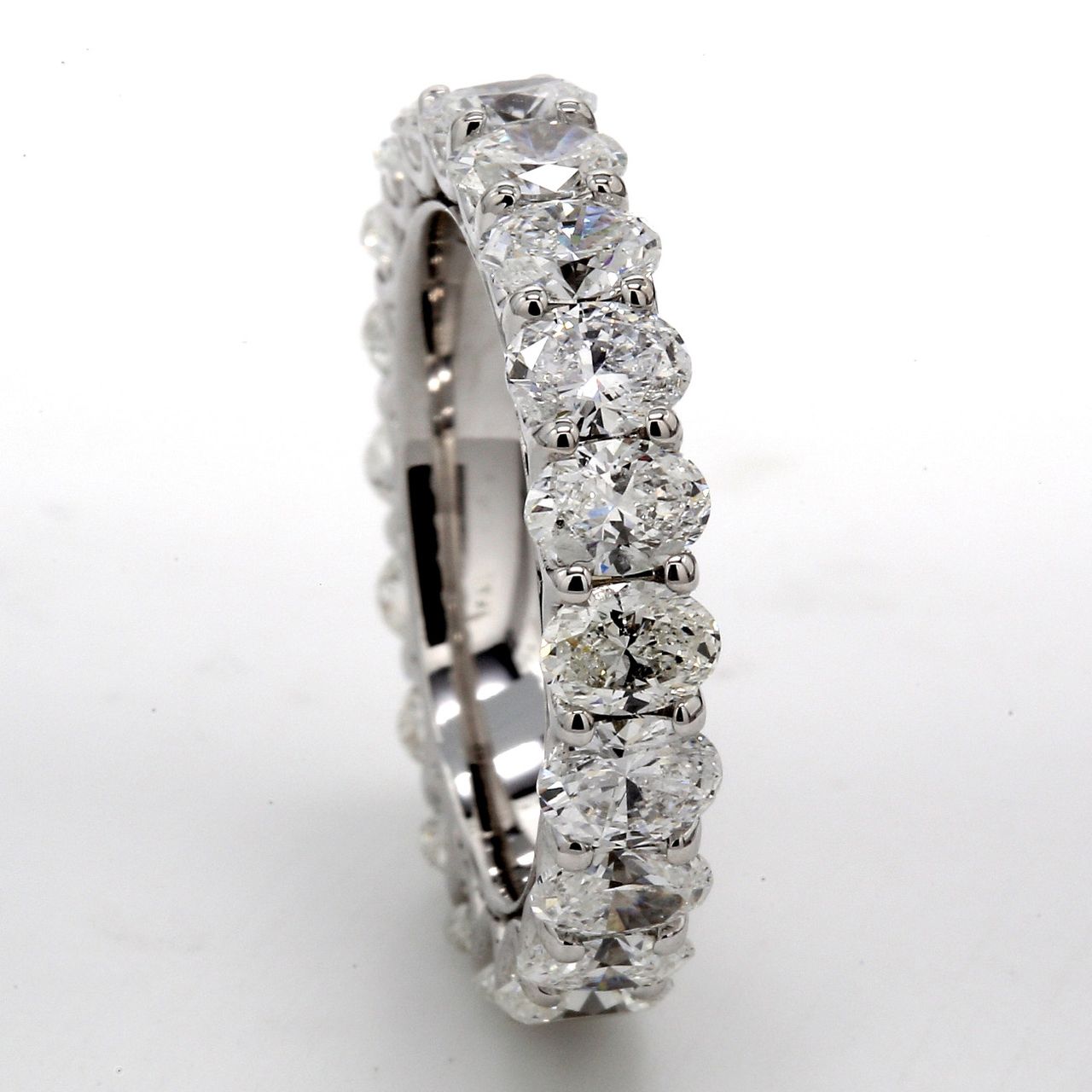 Eternity band in 18K WG with shared U-prong set (20) oval diamonds.  D3.72ct.t.w.  Size 5.5