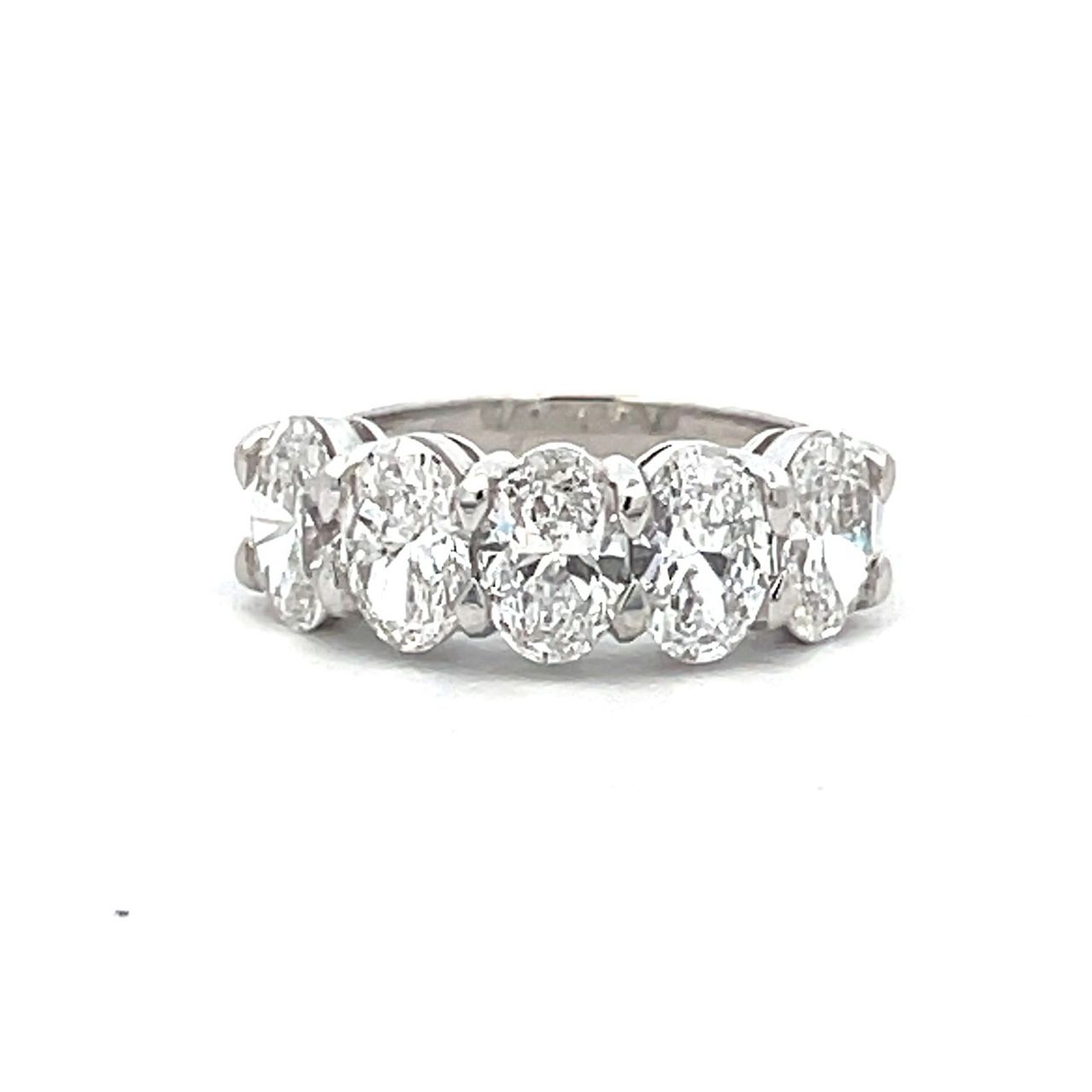 5-stone band in platinum with shared basket prong set D-F/SI2 GIA certified oval diamonds.  D2.51ct.t.w.  Size 5.5