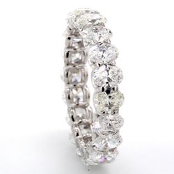 Eternity band in platinum with shared U-prong set (20) oval diamonds.  D4.40ct.t.w.  Size 7