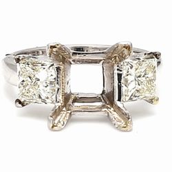 3-stone semi-mount in 18K WG w/ prong set princess cut diamond side stones.  D2.01ct.t.w.