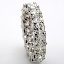 Eternity band in platinum with shared U-prong set (17) asscher cut diamonds.  D5.80ct.t.w.  Size 6