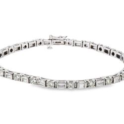 8' Tennis bracelet with alternating basket prong set (22) rounds and (44) baguette diamonds.  D5.66ct.t.w.