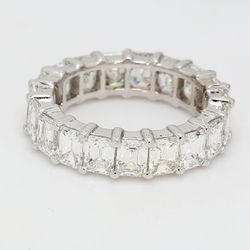 Eternity band in platinum with basket shared prong set emerald cut diamonds.  D5.80ct.t.w.  Size 6.5